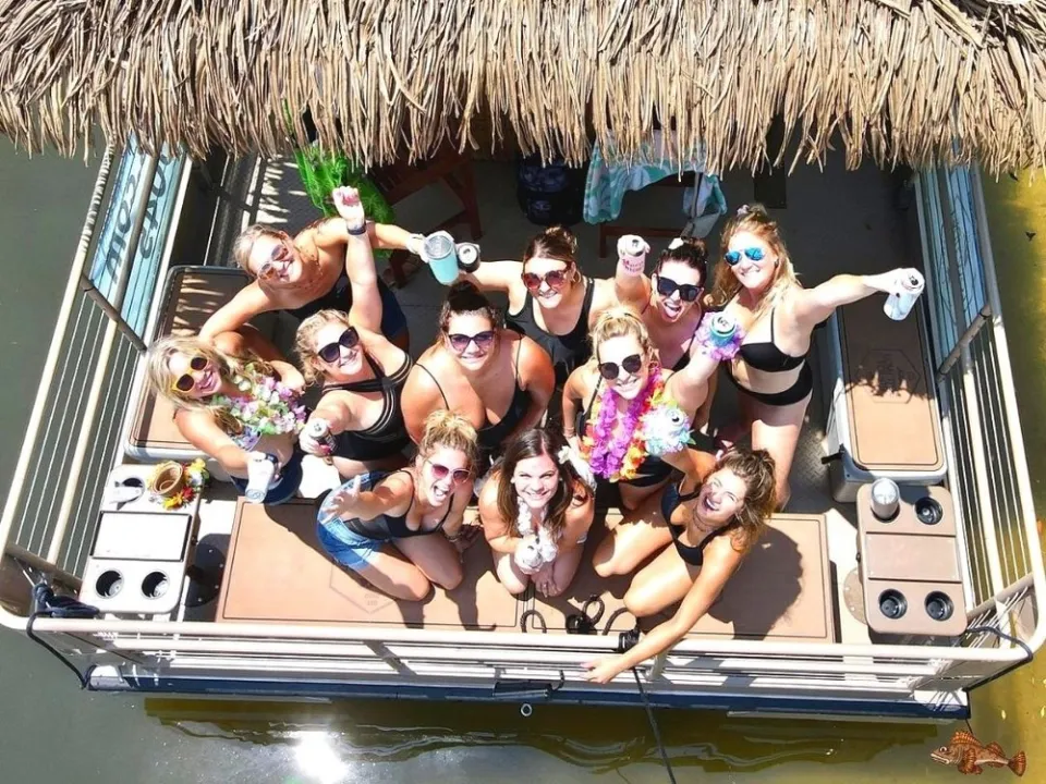 a group of people on a boat in the water