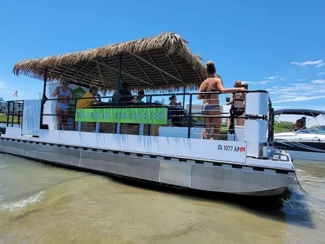 a group of people in a boat on a body of water