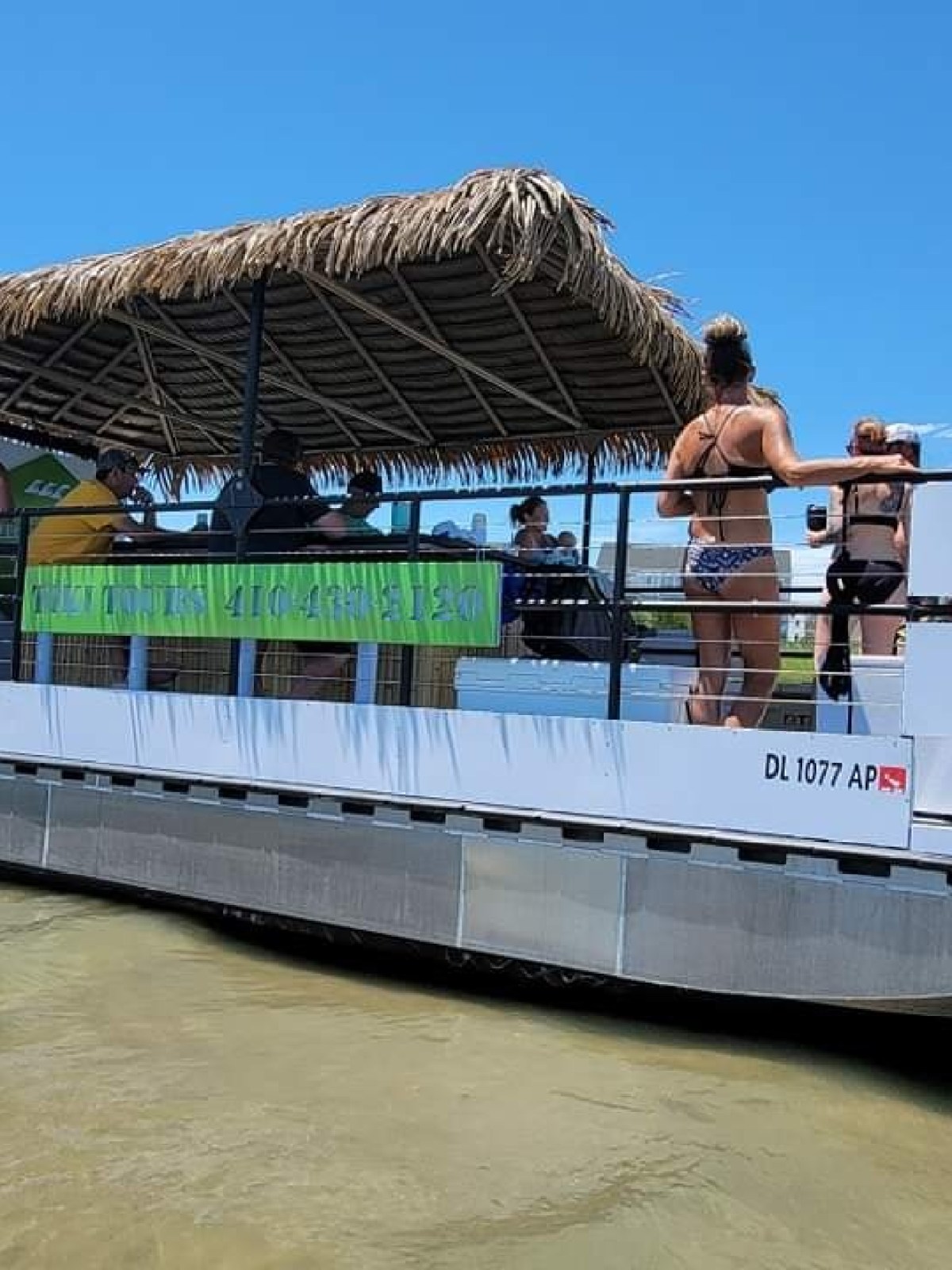a group of people in a boat on a body of water