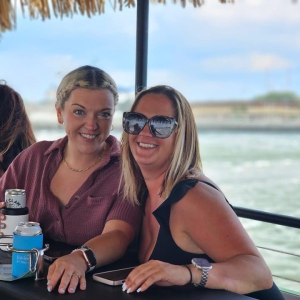 a couple of people that are sitting in the water