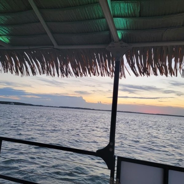 a wooden pier next to a body of water