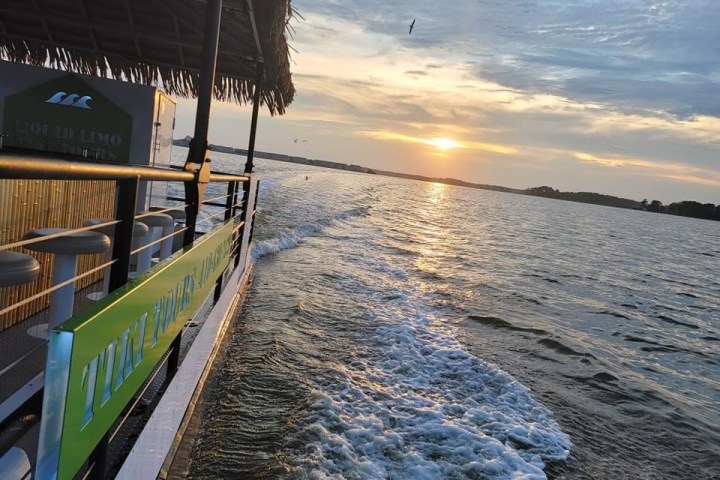 a close up of a pier next to a body of water